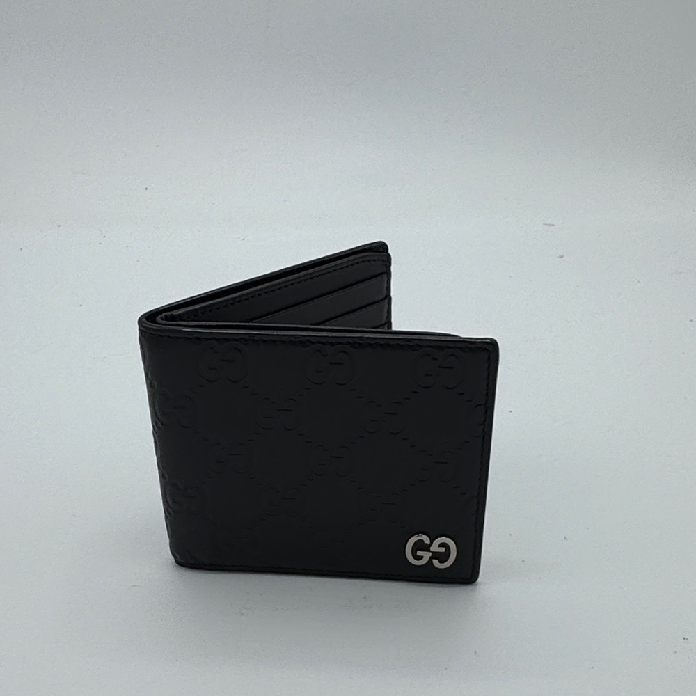 Men's Gucci bifold monogram leather wallet